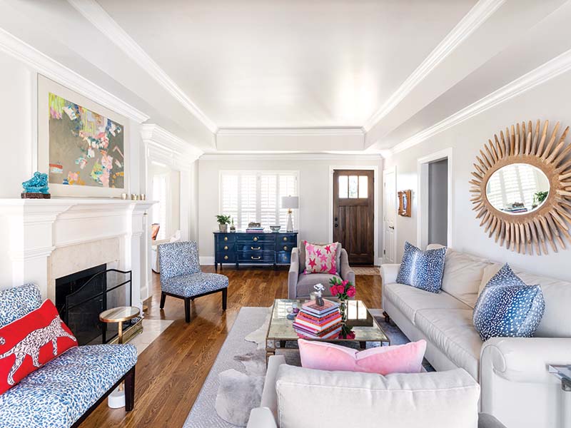 This room sets the stage for the rest of the home with an adept blend of vibrant colors and prints and just the right neutral grounding on the majority of walls and primary furnishings.