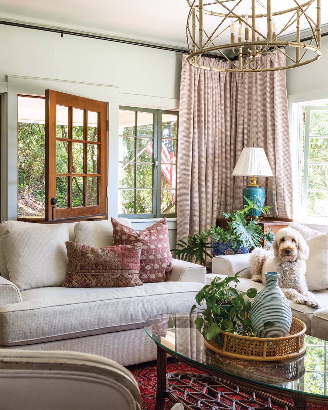 This cottage design delves deeply into color, with a palette inspired by a treehouse theme, as the home sits on a hillside with lush forest views.