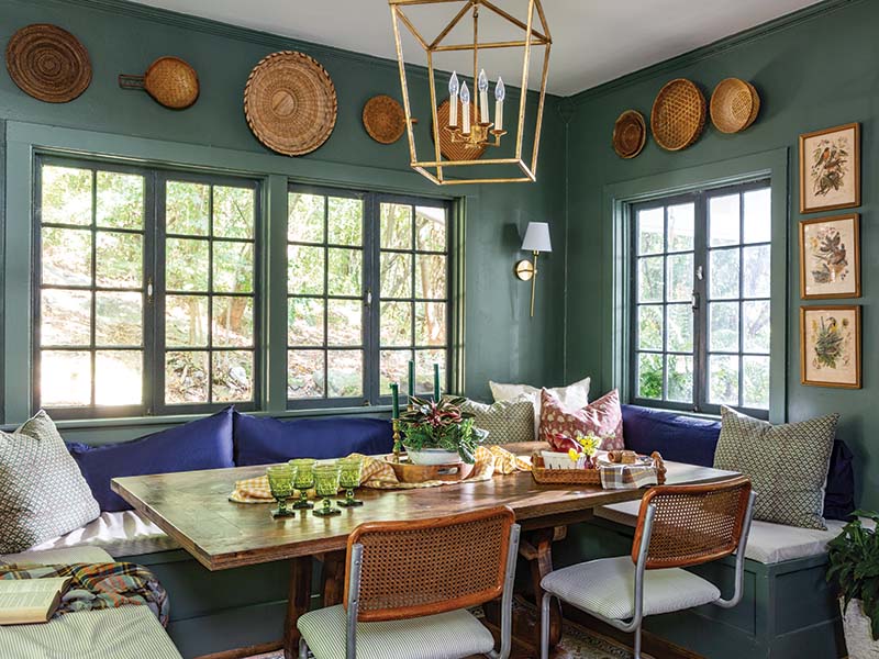 The banquet seating in the dining room was built extra deep to ensure comfort for the family of six, and the tabletop built by Suzanne’s husband crowns a base she found on the side of the road. “I really love a curated look,” says Suzanne, whose affinity for baskets and antique prints topped off the dining room with a flair of vintage charm.