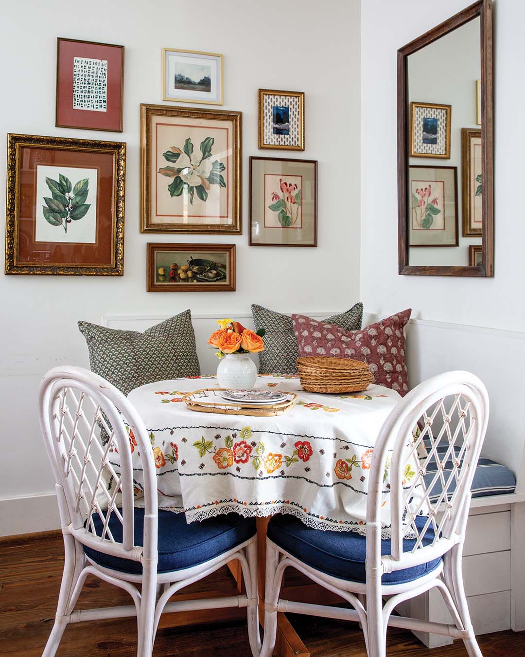 Framed needlework created for Suzanne’s grandmother by a close friend joins thrifted Spode dishes on the open shelving, and various paintings and prints sourced everywhere from Parisian flea markets to local secondhand shops are assembled in charming displays.