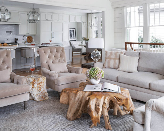 The teak root coffee table and petrified wood side table add a notable layer of interest and depth to a largely neutral living area while remaining practical choices. Balancing the unexpected, less-than-tradtional shape of the pieces, designer Perry Walter selected a sofa and chairs with classic silhouettes.
