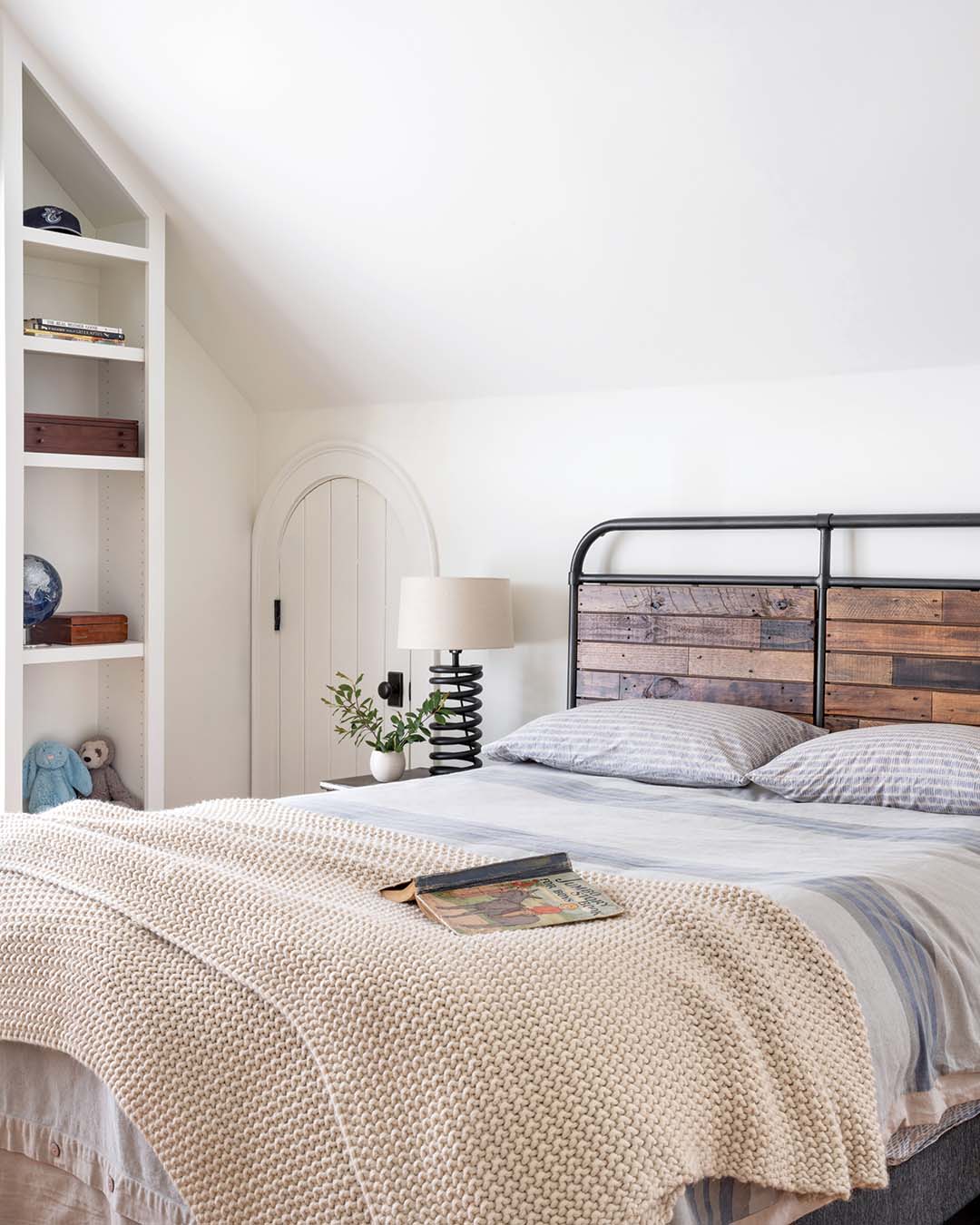 In this bedroom, a nature-inspired rustic take results in a warm space with a splash of masculine style.