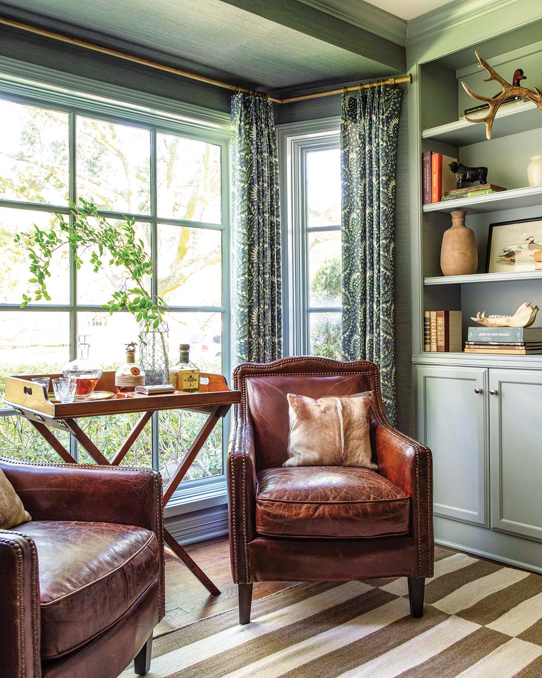“We reused the homeowners’ leather chairs in that window,” Katie says, referring to the sunny nook that takes up one end of the space. “I really loved how that worn leather looks with the blue paint.”
