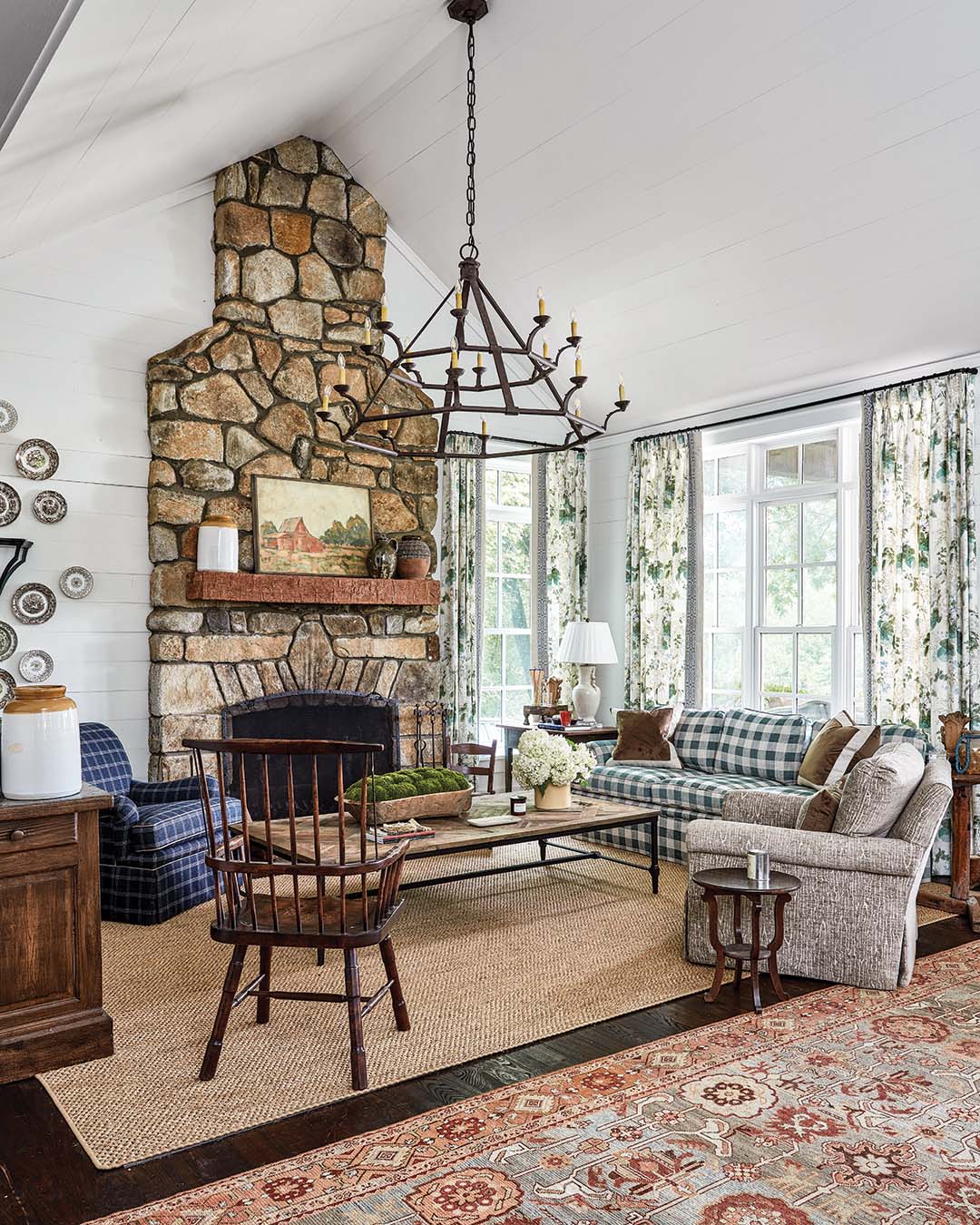 Large-scale jute rugs ground and define nearly every room in the home, providing a wear-and-tear base to layered antique and shag toppers.