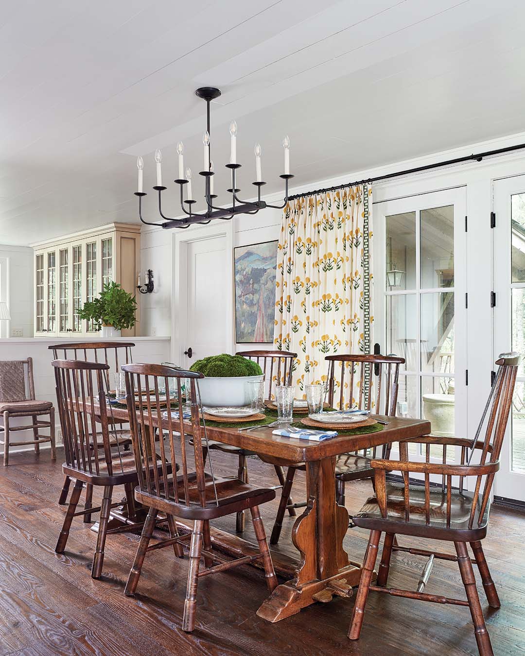 While Maggie says she often opts for brass in primary homes, when it comes to a cozy mountain retreat, wrought iron chandeliers better fit the aesthetic.