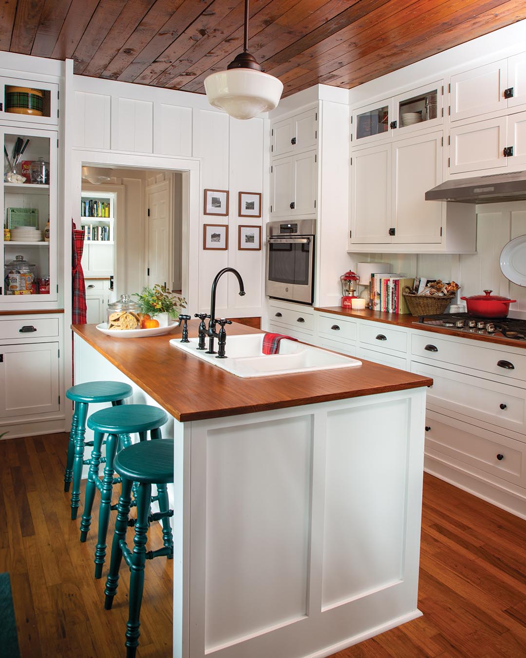 “In the rooms that didn’t have the original ceilings, [Walter] installed pine boards and stained them to match,” Kelly says. “I removed layers of wallpaper and cleaned the old wood floors, and my husband installed battens on the walls over the old paneling.”