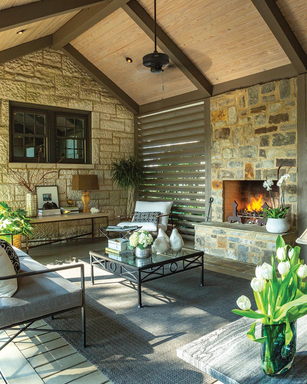 “Because of where we live, it is only natural to create outdoor living spaces that can be used all year,” Dwight says. The garden provides the perfect background for entertaining guests for an alfresco dinner, enjoying a quiet weeknight by the fire, or lounging poolside with a good book during the summer months.