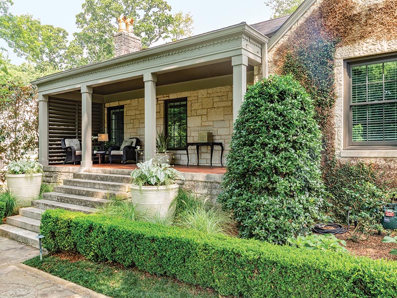 Opting to keep in-ground planting to a minimum, the team used planters and containers for a chic European look.