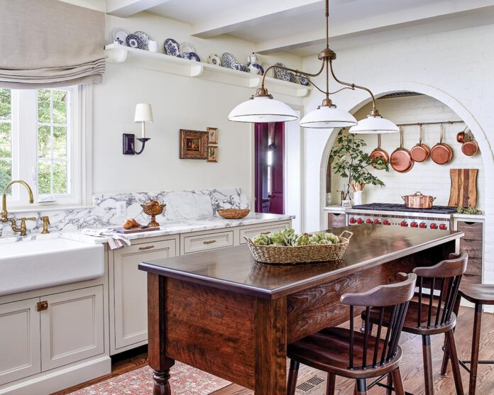 From vintage china to artwork, the homeowners’ storied treasures add prominently displayed character and contribute to a nuanced French vibe throughout this kitchen redesign. “Our clients really helped make this space feel so unique,” says interior designer Kasey Bedford of Winsome Interior Design. “They brought so many special collected items with them that really guided our creativity through the design process.”