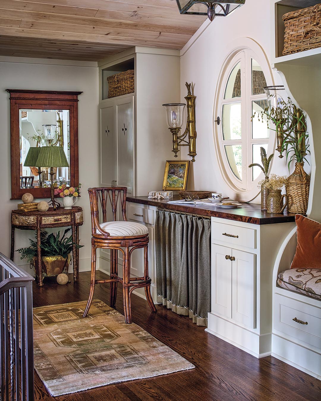 Debbie used a reversible wool fabric to create a skirt for the built-in desk, turning up the hem and securing it with an oversize cross-stitch for an interesting detail.