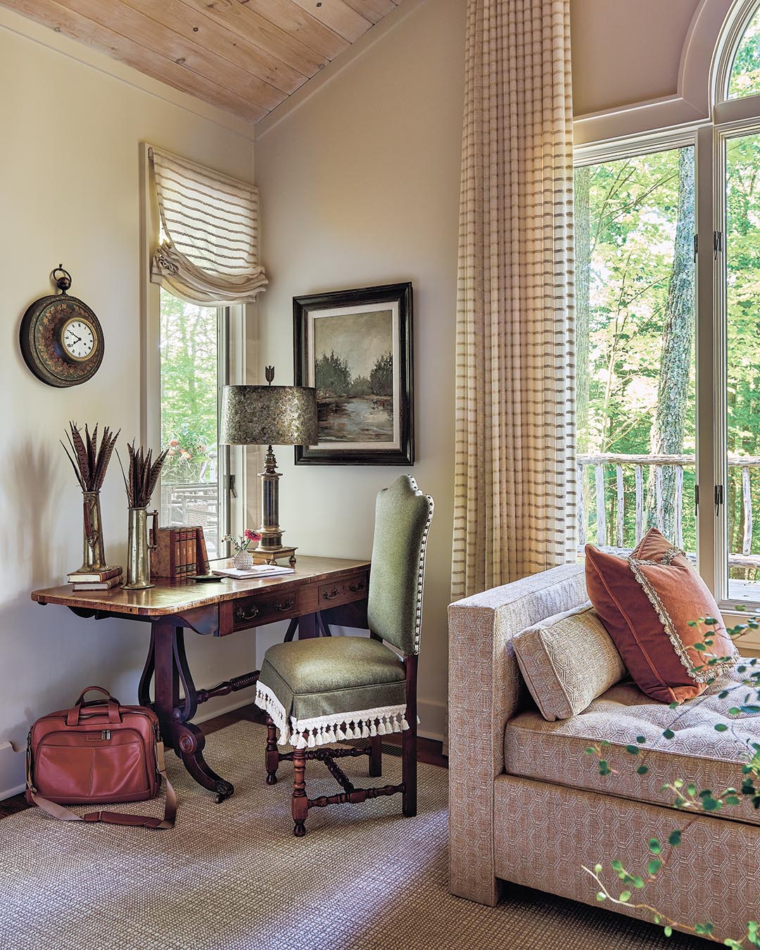 Finishes that infuse an old-world style provide warmth amid a palette that leans heavily into green tones, echoing the natural surroundings.