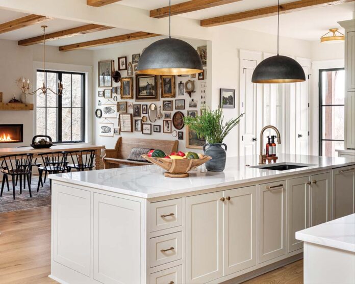 The gallery wall in the dining room was created with assistance from The Vintage Gallery Girl in Hendersonville, Tennessee, and incorporates family heirlooms, including the homeowner’s wedding bouquet.