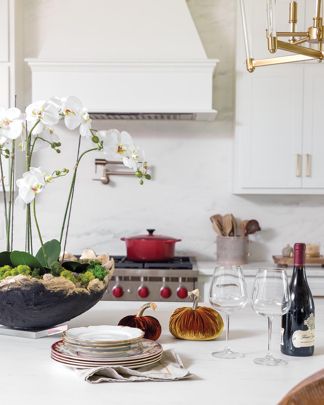 An expansive island centered in the heart of the home provides ample space for preparing meals and serves as the primary gathering spot whenever the Bennetts host family and friends.