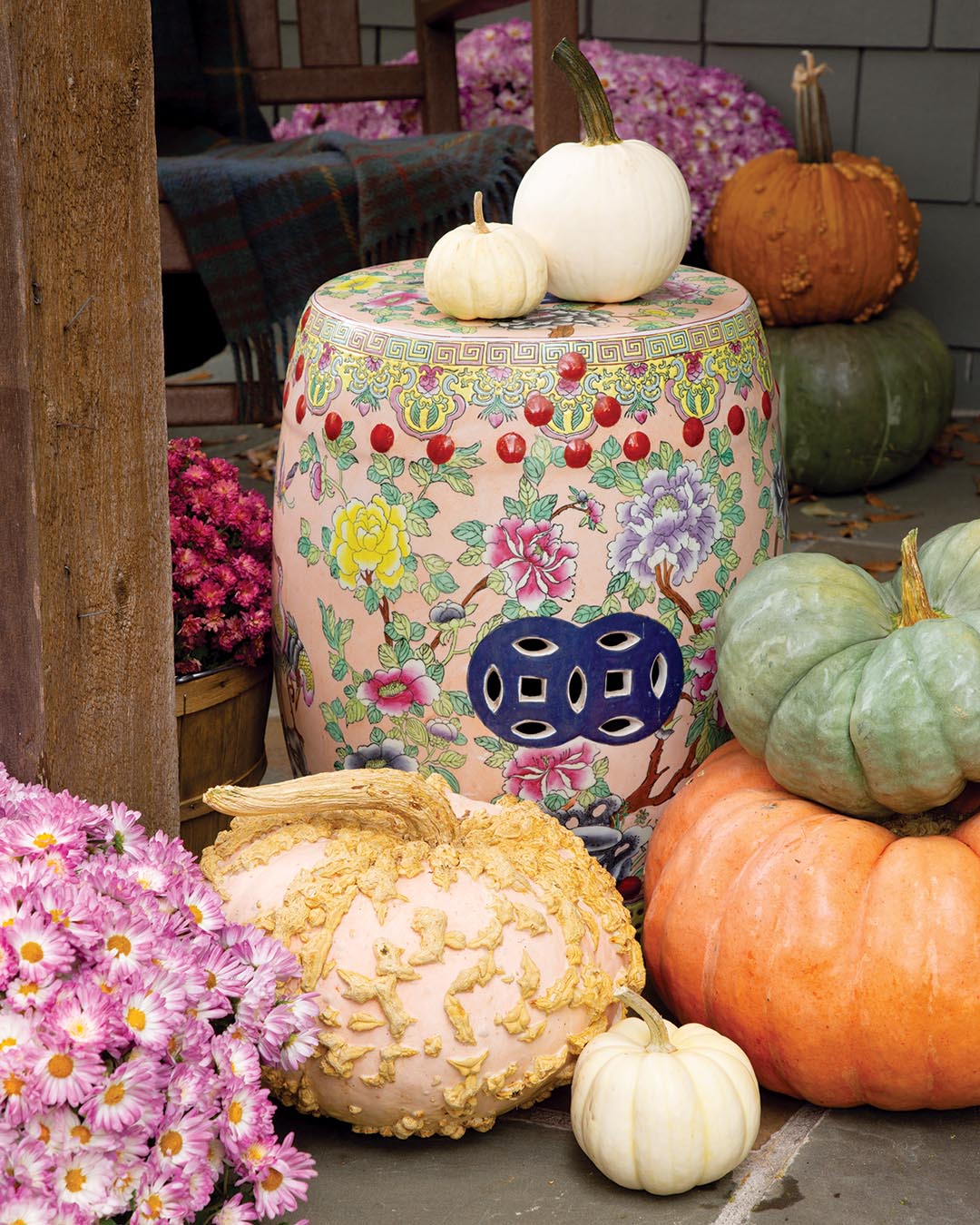 Incorporate garden stools in festive floral patterns for a creative way to lend contrast while providing a colorful accent to any porch.
