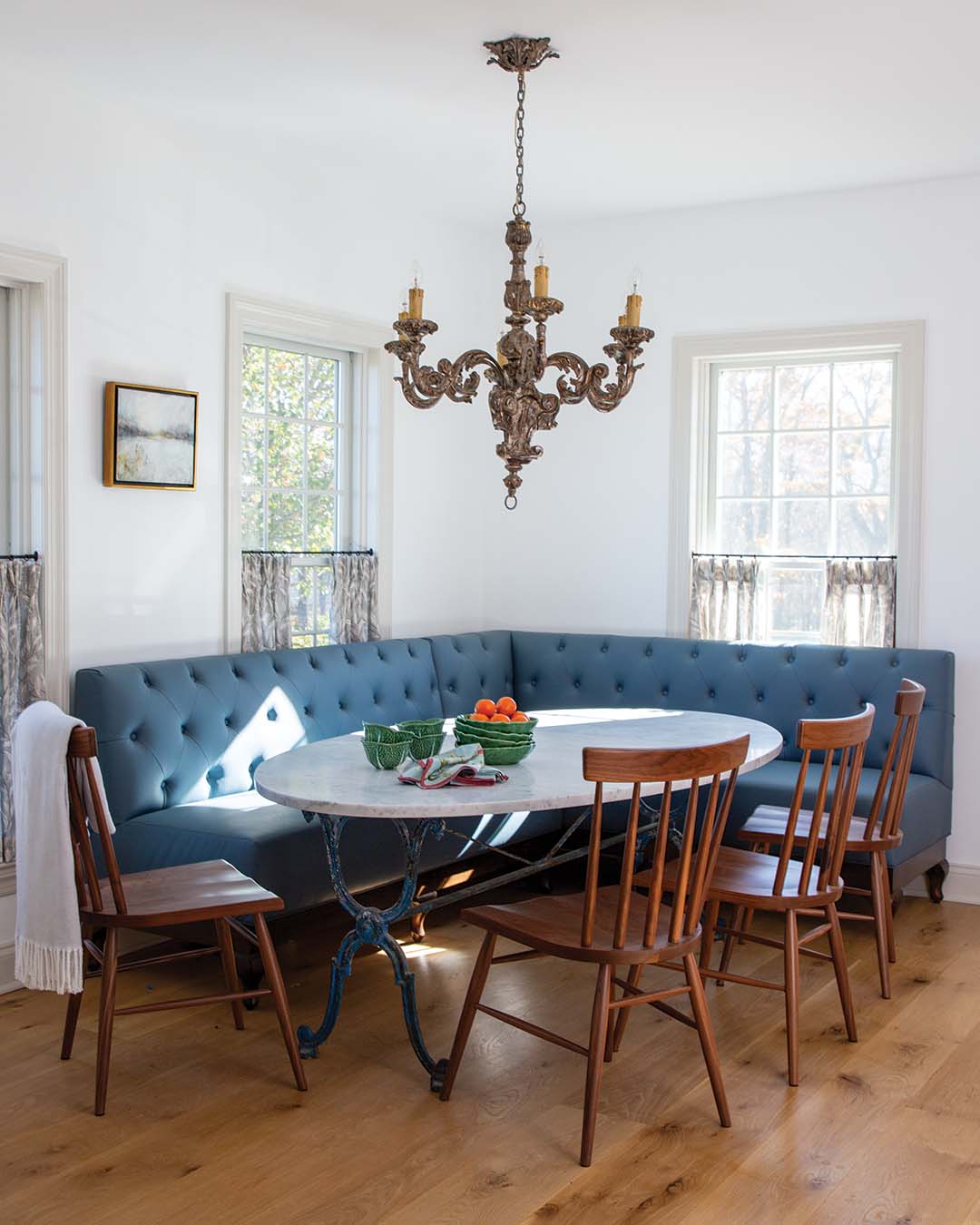 The kitchen's blue hues carry through to a custom banquette.