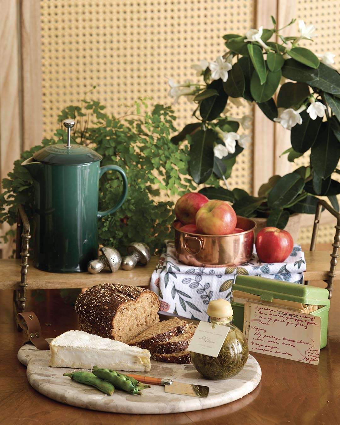 Marble cutting board from Mud Pie. Mushroom salt-and-pepper set from Lucy’s Market. Olive oil from Stone Hollow Farmstead. Kitchen tea towel from Geometry. Ceramic peas from CE Fine Art Studio.