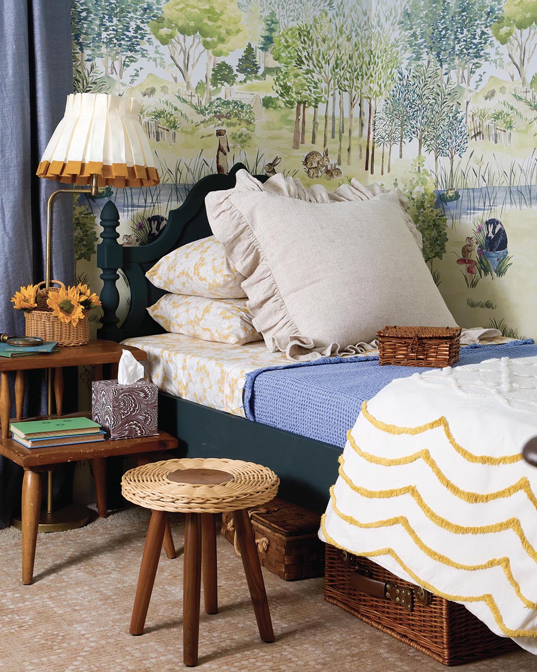 Wallpaper from Little Greene. Lampshade from Ciélle Home. Duvet cover and sheets from Golden Yarrow. Ruffle sham and throw from Annie Selke. Stool from Serena & Lily or 866-597-2742. Tissue box from Weezie.