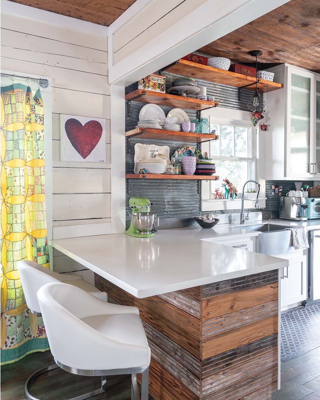 To maintain the aged spirit of the home as much as possible, the Hadaways sought out materials that would have existed at the time the home was built, such as the corrugated tin they used in the kitchen. Reclaimed from an old barn, the tin features the patina that Meredith wanted to see as well as a thinner corrugation that played into her love of texture.