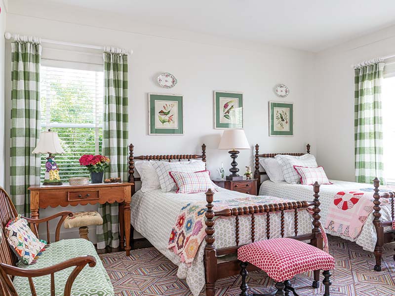 Dash & Albert rugs contribute color throughout the design, imitating the look of handmade while remaining a practical and cost-effective way of adding personality atop reclaimed pine floors.