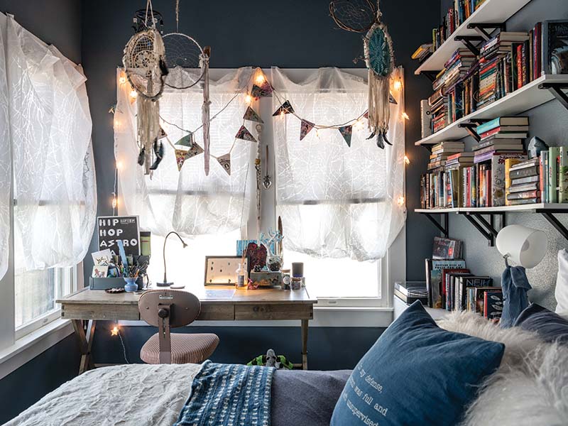 Painted in a moody gray, the Hadaways’ daughter’s bedroom allows a stunning view of the surrounding landscape, including the plentiful local wildlife.