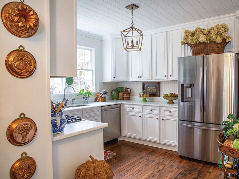 Although the kitchen required extensive work—from the removal of the linoleum and installation of new cabinetry to the rewiring of the electrical system—the all-white space remains rich in vintage charm, partly thanks to Beth’s insistence that the nails and imperfections in the wood floors be left intact.