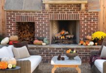This Cozy Garden Space Was Made for Fall Entertaining Come autumn, nothing beats the comfy living area outfitted with both a brick wood-burning fireplace and TV, making it the ideal hangout for football games.