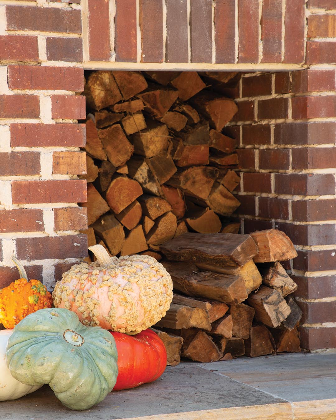 Come autumn, nothing beats the comfy living area outfitted with both a brick wood-burning fireplace and TV, making it the ideal hangout for football games—especially once the cooler temperatures set in.