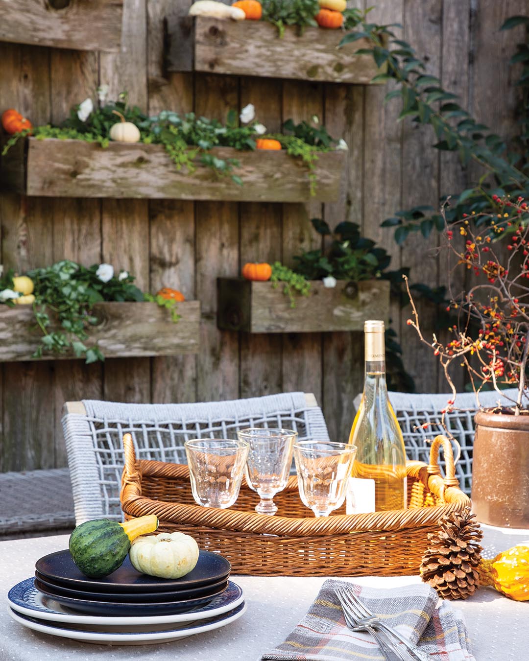  “The planters are vertically scattered across the fence, like scaled notes on a sheet of music, and cleverly create a focal point,” he says. “Trailing vines and seasonal color look great in them. And the planters are all compact enough that they’re easy to maintain and don’t vacuum up a lot of valuable space.”