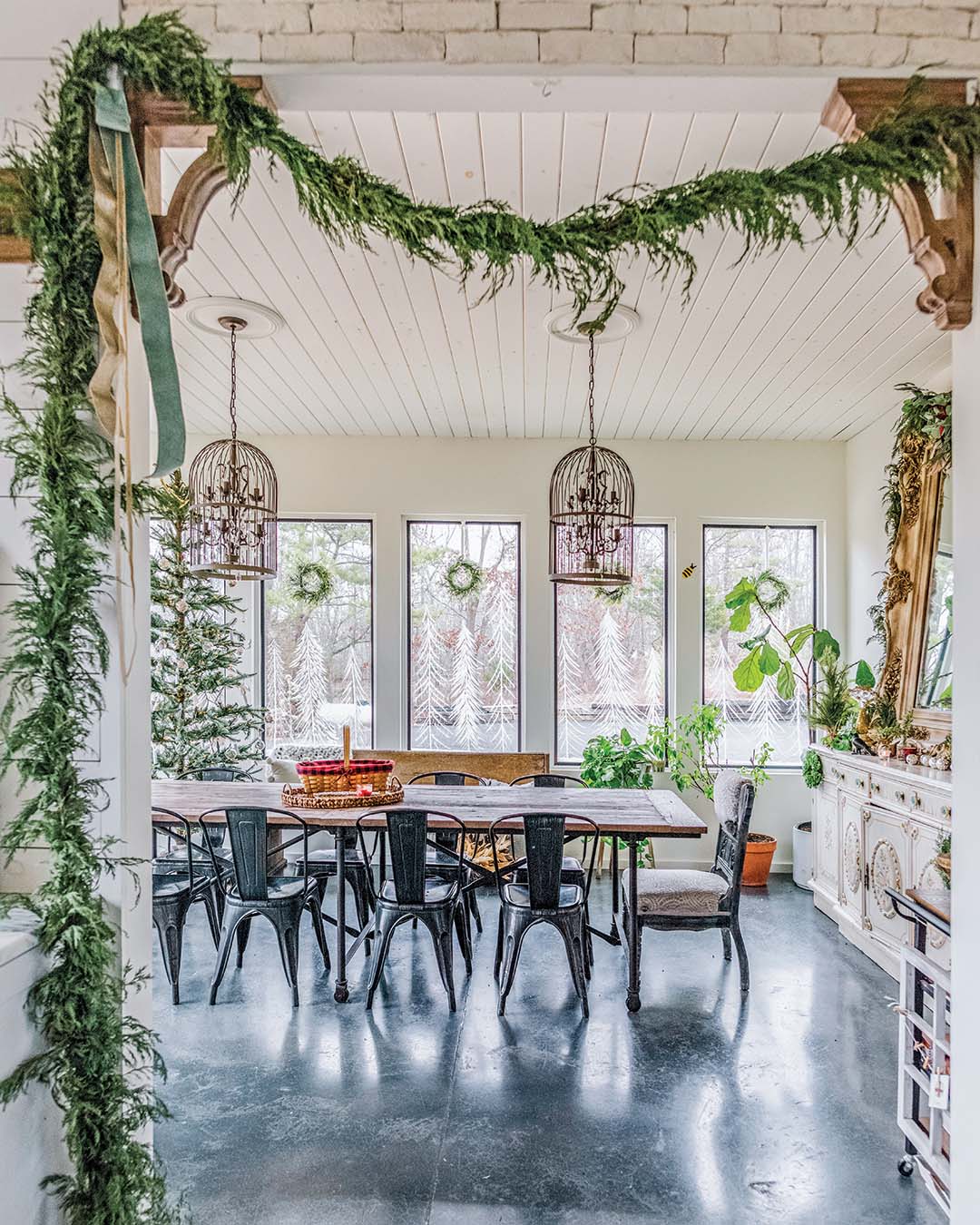 “My favorite room to decorate is the dining room; it’s where we gather the most,” Annette says. “Sharing mealtime together is important to us, so I wanted to do something special . . . I drew on the windows, decorated with our homemade ornaments, and added pine trees and dried plants for ambience.” Incorporating a personal touch, such as homemade ornaments, is a great way to enhance your décor while still creating a cozy and inviting atmosphere.