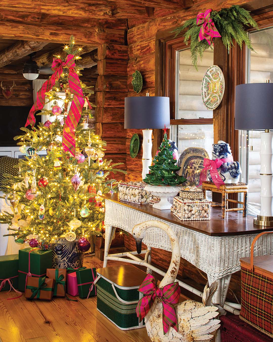 Proudly displayed atop a weathered wicker side table is a ceramic tree that belonged to homeowner Julie Anderson’s grandmother. The vintage-look metal swan below elegantly sports a plaid bow at Christmas.