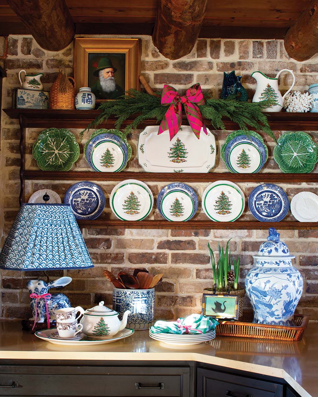 Julie credits her affinity for blue-and-white china to her mother, joking, “She still won’t let me have hers.” But she’s amassed her own impressive collection, and it lives among various other styles, shapes, and colors of dishware, brightening up dark wood cabinets and shelving and adding an unexpected element to her Christmas table.