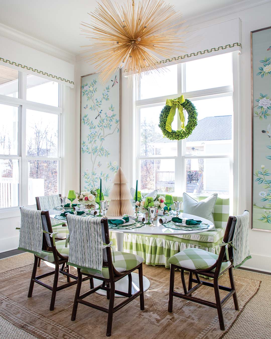 As green is key in the home’s everyday design, the same chartreuse appears on the living room chairs and dining space’s banquette and cushions.