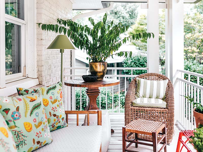 The newly added front porch now exudes a relaxed cottage charm.