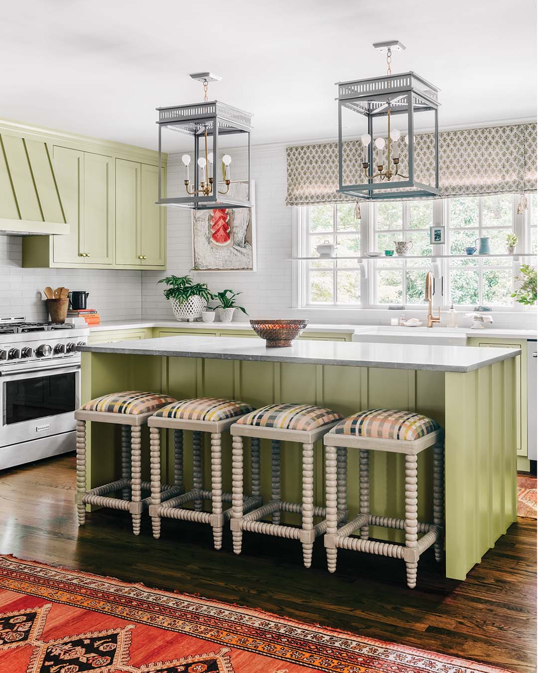 Selecting a striking cabinet color and a backsplash tile that stretches to the ceiling made this cottage kitchen a showstopper.