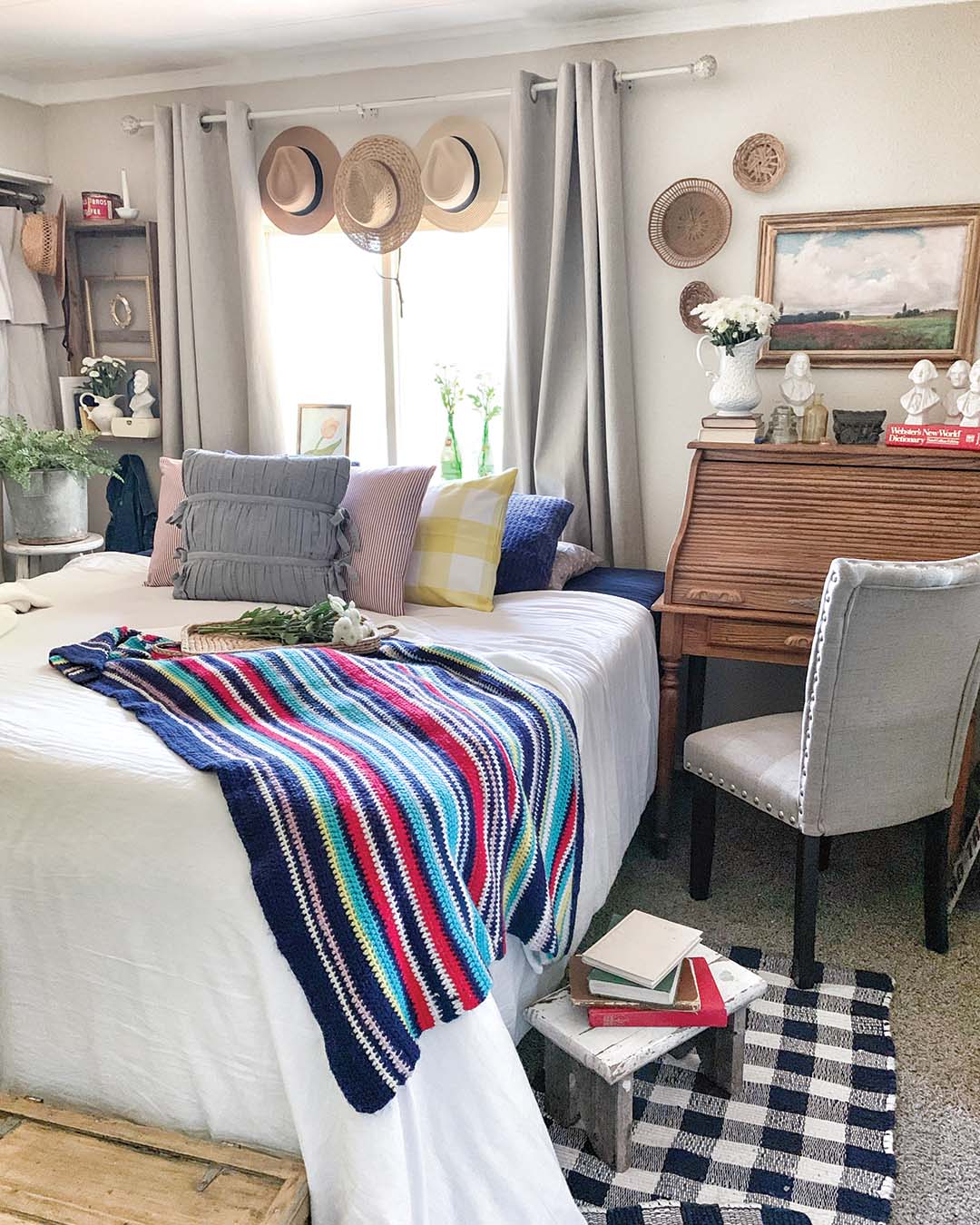 The hats displayed throughout the home are inexpensive secondhand finds that Becca says remind her of the hats her grandpa used to wear out in his garden.