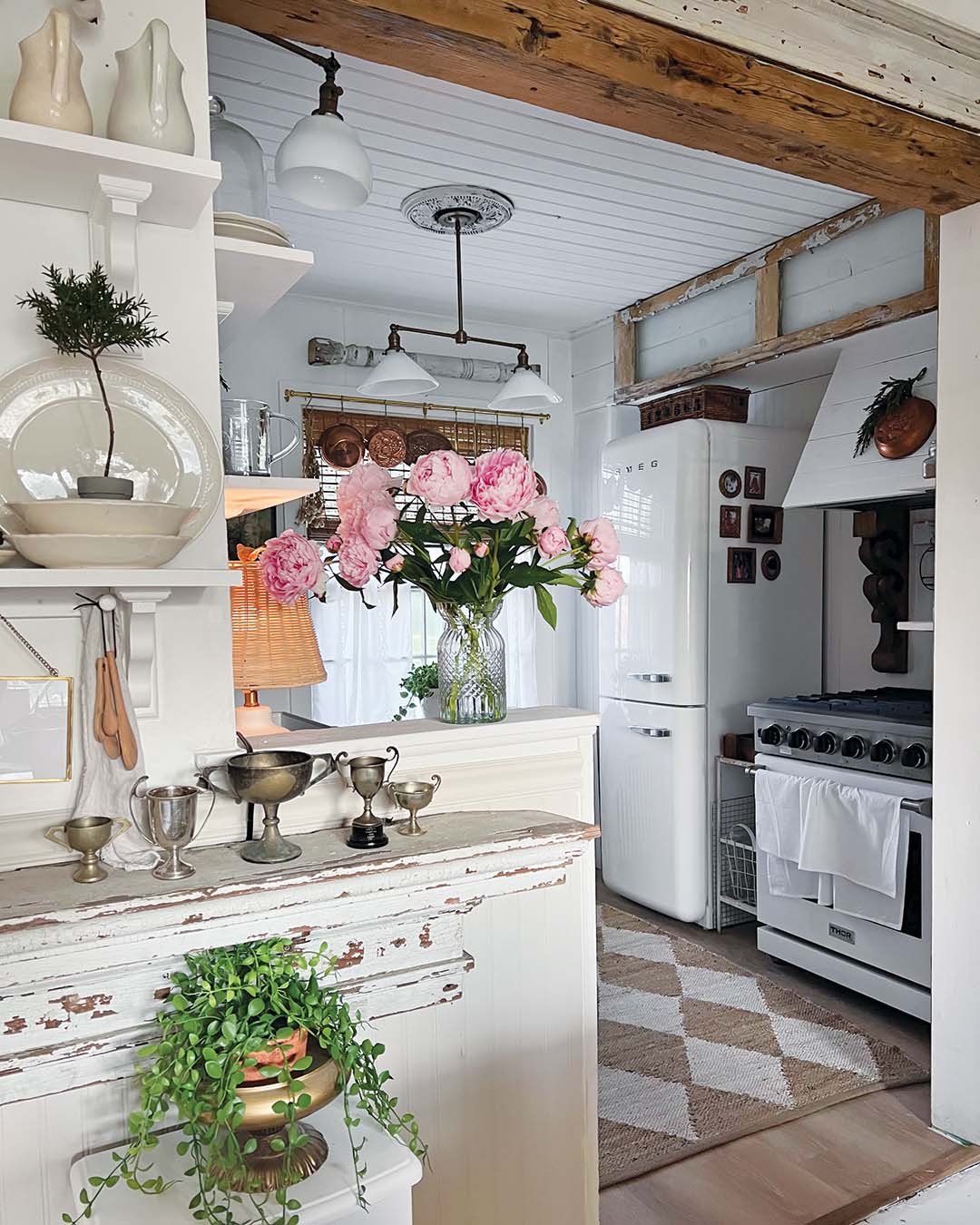 The couple had more luck with the kitchen ceiling—uncovering original shiplap, which they accented with a wood beam from a local salvage shop.